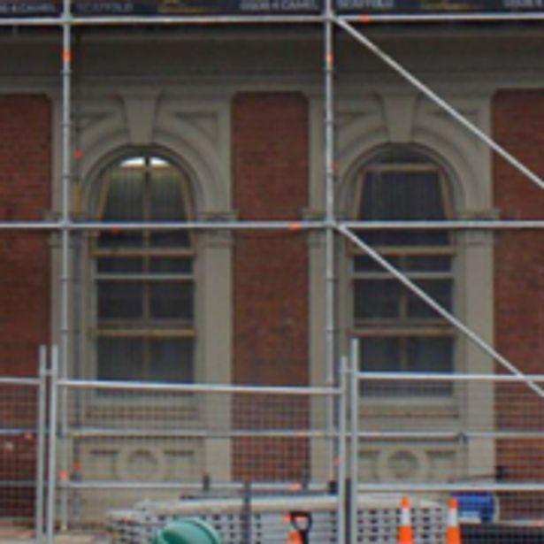 Small part of a building setup with scaffolding for renovation